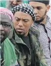  ?? HENNING KAISER/ AFP/DPA ?? Former German rapper Denis Cuspert, centre, was an ISIL recruiter.