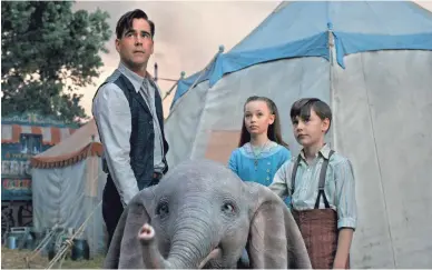  ?? DISNEY ?? Former circus star Holt Farrier (Colin Farrell, left) and his children Milly (Nico Parker) and Joe (Finley Hobbins) care for a very special newborn elephant in Tim Burton’s “Dumbo.”