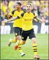  ??  ?? Dortmund’s Spanish forward Paco Alcacer and French defender Abdou Diallo (left), celebrate scoring 4-3 against Augsburg during the German first division Bundesliga football match Borussia Dortmund vs FC Augsburg in Dortmund, western Germany, on Oct 6. (AFP)