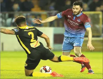  ??  ?? Above: Tobi Adebayo- Rowling challenges Killian Brennan while ( inset) Liam Martin holds off a Drogheda player during Rovers’ 1- 1 draw with the Louth side at United Park . Photos: Paul Connor