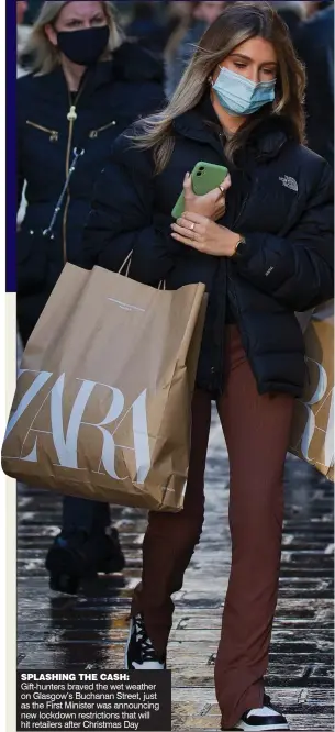  ??  ?? SPLASHING THE CASH: Gift-hunters braved the wet weather on Glasgow’s Buchanan Street, just as the First Minister was announcing new lockdown restrictio­ns that will hit retailers after Christmas Day