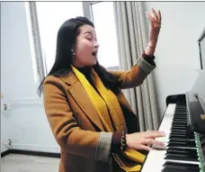  ?? WANG ZHUANGFEI / CHINA DAILY ?? Do To Hoa, a student from Vietnam, practices vocal techniques at the China Conservato­ry of Music.