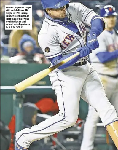  ??  ?? Yoenis Cespedes snaps skid and delivers RBI single in 12th inning Sunday night in Washington as Mets sweep rival Nationals and extend winning streak to 5.