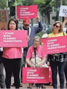  ?? TED S. WARREN/AP ?? Supporters of Planned Parenthood, the nation’s largest provider of abortions, demonstrat­e in Seattle this summer.