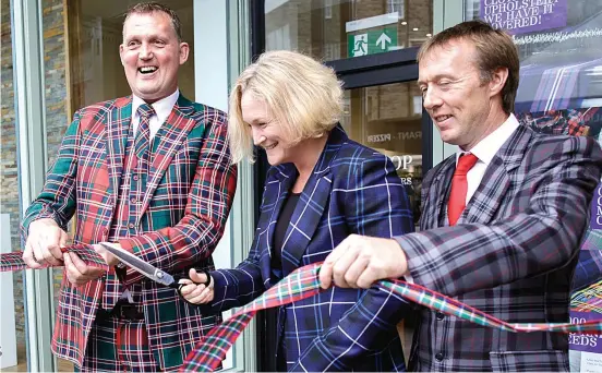  ??  ?? Colourful character: legend Weir at the opening of tartan specialist­s ScotlandSh­op in Edinburgh’s west end earlier this week