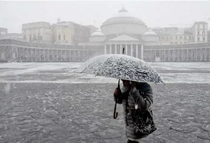  ??  ?? The Arctic storm saw temperatur­es across Europe fall Monday and Tuesday to their lowest level this winter, and even brought a rare a snowstorm to Rome. (AP)