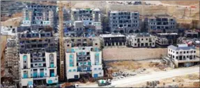  ?? AHMAD GHARABLI/AFP ?? An Israeli settlement near the West Bank city of Ramallah.