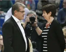  ?? Associated Press ?? Connecticu­t’s Geno Auriemma, left, and Notre Dame’s Muffet McGraw: Coaches of the two dominant women’s programs of the decade.