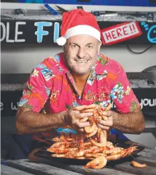  ?? Ingham Road Seafood owner Mark Partland. Picture: SHAE BEPLATE ??