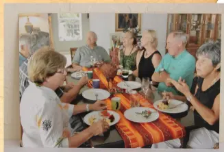  ??  ?? Tanya and Mike Hochschild with friends, fun and home- cooked food at home on Sanibel.