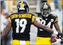  ?? Keith Srakocic The Associated Press ?? Steelers wide receiver Antonio Brown, right, celebrates one of his 12 leaguelead­ing touchdowns with teammate Juju Smith-schuster.