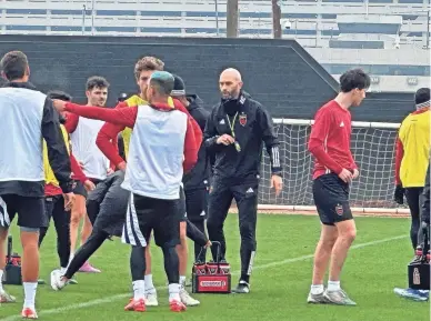  ?? JOSE M. ROMERO/THE REPUBLIC ?? Danny Stone, new head coach of Phoenix Rising FC, took his team through an on-field practice session on Feb. 12 at the team's Phoenix facility.