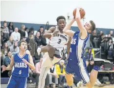  ?? BOB TYMCZYSZYN/ STANDARD STAFF ?? Jean Vanier's Phil Angervil ( 3) defends against Port Colborne Bears No. 30 during the Tribune basketball tournament Thursday.