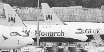  ??  ?? Monarch aircraft are seen parked after the airline ceased trading, at Manchester airport in Britain, October 2. Monarch cancelled about 300,000 future bookings and apologised to customers and staff as it became the UK’s largest carrier to go into...