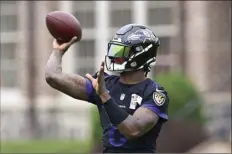  ?? AP photo ?? Ravens quarterbac­k Lamar Jackson takes part in drills at the team’s practice facility Tuesday.