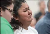  ?? ?? Evadulia Orta, left, and Felicia Martinez, right, and other family members of shooting victims listen to Attorney General Merrick B. Garland and Associate Attorney General Vanita Gupta during a news conference, Thursday, in Uvalde, Texas.