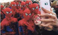  ?? KIM HEE-CHUL, EUROPEAN PRESSPHOTO AGENCY ?? People in Spider-Man costumes and make-up take a selfie at the premiere of Spider-Man: Homecoming at a theater in Seoul on Sunday. Spider-Man in a web of teen angst, IN LIFE.