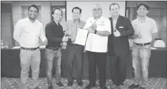  ??  ?? Yii (third right) presenting a special approval letter to Daneil witnessed by Lee (third left), Allen (left), Law (second right) and Chin (right).