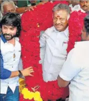  ?? PTI FILE ?? Former Tamil Nadu chief minister O Panneersel­vam being greeted by his supporters at his residence in Chennai.