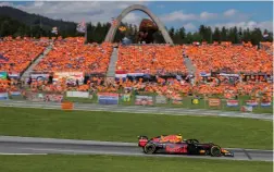  ??  ?? DUTCH POWER: Max Verstappen races past a crowd of orange-shirted fans at the Red Bull Ring in Spielberg yesterday.