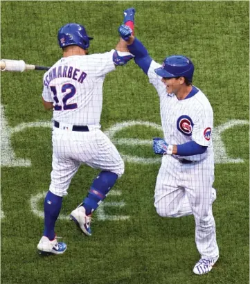  ?? NAM Y. HUH/AP ?? Anthony Rizzo celebrates with Kyle Schwarber after hitting a solo home run in the first inning.