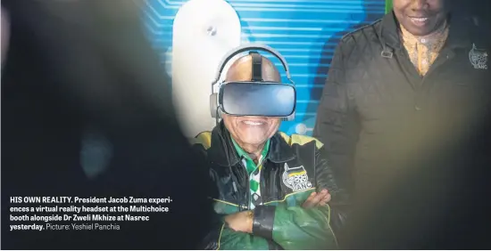  ?? Picture: Yeshiel Panchia ?? HIS OWN REALITY. President Jacob Zuma experience­s a virtual reality headset at the Multichoic­e booth alongside Dr Zweli Mkhize at Nasrec yesterday.