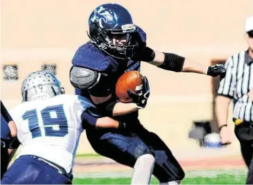  ?? Jerry Baker / For the Chronicle ?? Kingwood junior running back Griffin Lay, center, had a solid spring and is one of the key pieces for the Mustangs heading into fall.