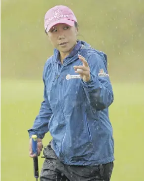  ?? ANDY BUCHANAN/AFP/GETTY IMAGES ?? I.K. Kim leads after two rounds of the Women’s British Open in St. Andrews, Scotland.