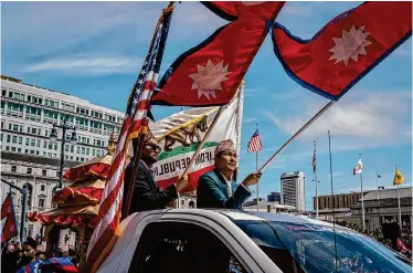  ?? Loren Elliott/Special to the Chronicle ?? Members of the Nepalese community participat­e in the Nepal Day Parade on Sunday in San Francisco.