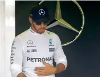  ?? Reuters ?? Lewis Hamilton of Mercedes leaves the garage. —