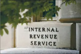  ?? ASSOCIATED PRESS ?? A sign outside the Internal Revenue Service building is seen, May 4, 2021, in Washington. Tax Day reveals a major split in how Joe Biden and Donald Trump would govern: The presidenti­al candidates have conflictin­g ideas about how much to reveal about their own finances and the best ways to boost the economy through tax policy.