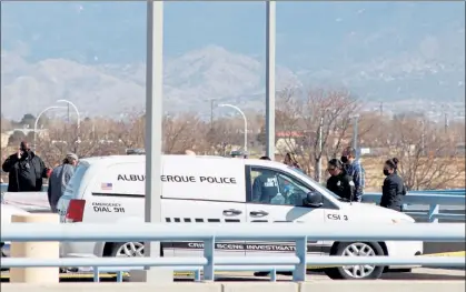  ?? MATTHEW REISEN / THE ALBUQUERQU­E JOURNAL VIA AP ?? Police investigat­e where four bodies were found March 5 on the upper level of the parking garage at the Albuquerqu­e Internatio­nal Sunport airport in New Mexico.