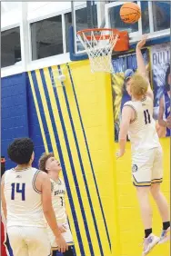  ?? Westside Eagle Observer/MIKE ECKELS ?? Bulldog Deegan Brooks (11) puts up a shot high off the glass during the Friday night Decatur-Fort Smith basketball contest in Decatur. Brooks hit 15 points.