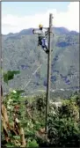  ?? Special to the Democrat-Gazette/
ROB ROEDEL ?? John Hawkins of First Electric Cooperativ­e works on a power pole in Guatemala in October.