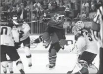  ?? MARTIN ROSE, GETTY IMAGES ?? Wayne Simmonds of Canada flies high during Thursday’s quarter-final against Germany in Cologne. Canada won, 2-1. Canada will face Russia in the semifinals Saturday.