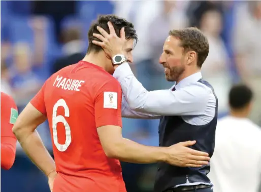  ?? AP ?? England head coach Gareth Southgate (right) and Harry Maguire celebrates the team’s victory over Sweden at the Samara Arena on Saturday. —