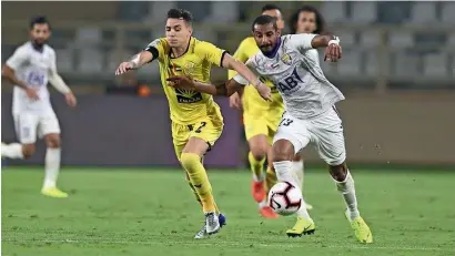  ??  ?? Al Ain and Al Wasl players duel for the ball during the President’s Cup first round match on Friday. —