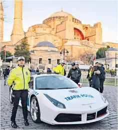  ?? ?? A Turkish traffic police officer alongside a converted Ferrari 488 GTB police vehicle