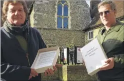  ?? Picture: Chris Davey FM4716736 ?? Canterbury Archaeolog­ical Trust director Paul Bennett and Andrew Richardson with the petition to keep open the Canterbury Heritage Museum