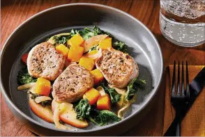  ?? TOM MCCORKLE/WASHINGTON POST ?? Fennel-rubbed pork tenderloin with squash, apple and kale.