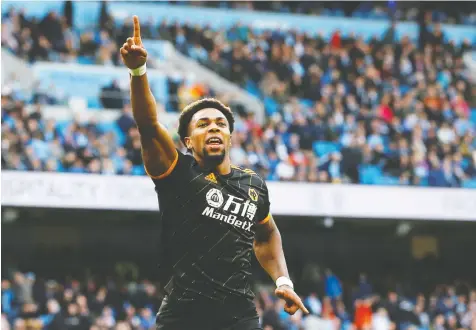  ?? — REUTERS ?? Wolverhamp­ton Wanderers’ Adama Traore celebrates scoring his side’s second goal on the way to shutting out Manchester City 2-0 in Premier League action Sunday in Manchester.