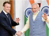  ?? — PTI ?? Prime Minister Narendra Modi with French President Emmanuel Macron in New Delhi on Saturday.