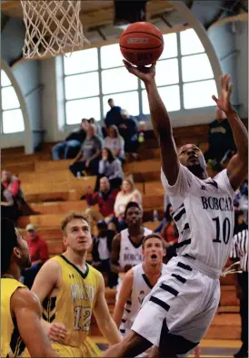  ??  ?? Georgia Northweste­rn’s Demonte Parker puts up a shot in the paint during the Bobcats’ season finale at home against Warren Wilson (N.C.) College on Saturday in Rossville. The visiting Owls claimed an 85-58 win as the Bobcats finished the year with a...