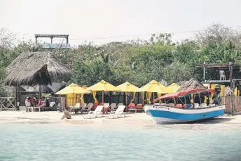  ?? ?? Tourist enjoy at the beach in Tierra Bomba Island, Cartagena, Colombia.