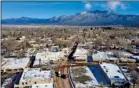  ?? MORGAN TIMMS/Taos News ?? Starting Wednesday (Dec. 2), Taos County will enter the ‘red’ level of reopening, which will allow houses of worship and close-contact business to operate at 25 percent capacity. Taos is seen from above Wednesday morning (Dec. 2).