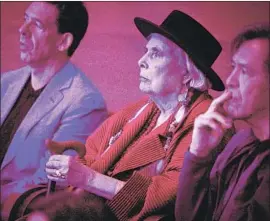  ?? Danny Clinch ?? JONI MITCHELL listens as Brandi Carlile performs her music at Disney Hall. Fans cheered Mitchell afterward and Carlile presented her with a bouquet.