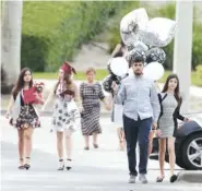  ?? THE ASSOCIATED PRESS ?? People leave a graduation ceremony Sunday for Marjory Stoneman Douglas seniors in Sunrise, Fla.