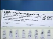  ?? DAVID J. PHILLIP — THE ASSOCIATED PRESS ?? A vaccinatio­n record card is shown during a COVID-19 vaccinatio­n drive for Spring Branch Independen­t School District education workers Tuesday, March 16, in Houston. School employees who registered were given the Pfizer vaccine.