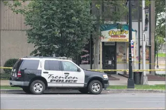  ?? RICH HUNDLEY III — FOR THE TRENTONIAN ?? A woman was shot outside Peter’s Pizza and Deli on Thursday afternoon.