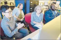  ?? MARK MIRKO/HARTFORD COURANT ?? From left, Michelle Tom of the Windsor Historical Society, Jenny Hawran of WIN-TV, Christine Ermenc of the Windsor Historical Society and Howard Marsh of WIN-TV edit some of the 40 hours of interviews conducted for “Windsor Phoenix: Rememberin­g the 1979 Tornado.”